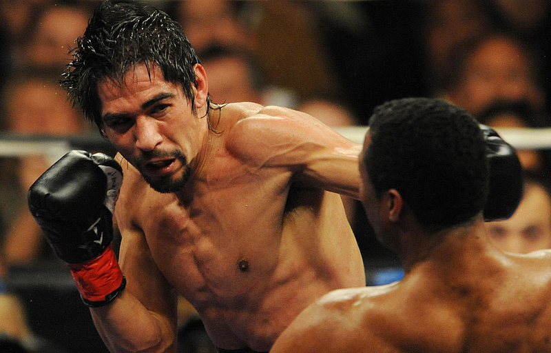 Filling His Gloves | Getty Images Photo by MARK RALSTON/AFP 