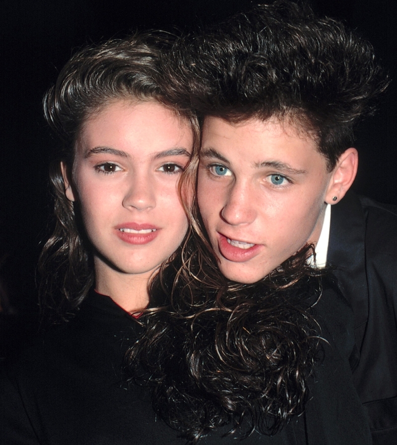 Alyssa Milano und Corey Haim | Getty Images Foto von Walter McBride/Corbis